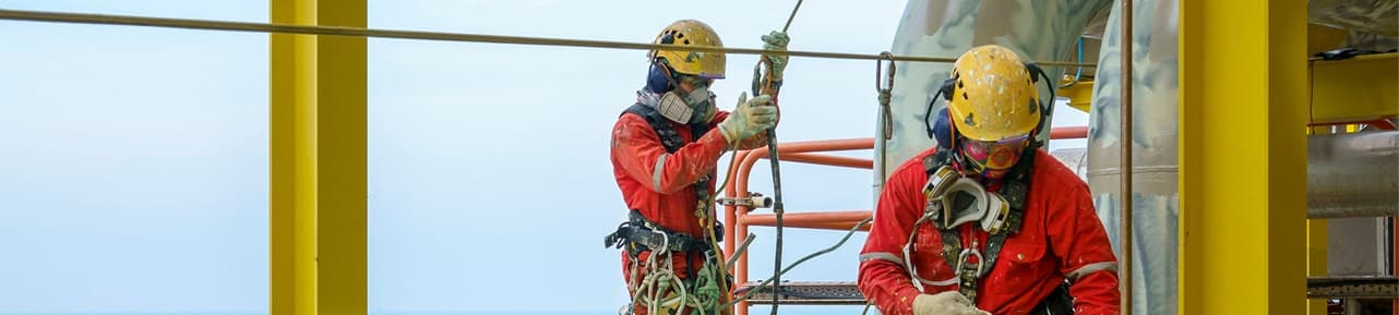 Oil refinery worker monitoring electrical systems