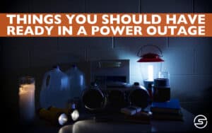When winter hits, it is not uncommon to experience power outages. Storms can knock down power poles, and falling trees and branches can pull down power lines. Even if you ignore weather forecasts, most utility companies are diligent about warning their customers of anticipated storms and potential outages. This warning gives utility customers ample time to take precautions if their power goes out. Rather than wait until the last minute, have some items already on hand at the beginning of storm season so you can muddle through until the power company can get you back on line. Here are a few tips for helping you prepare. Four Essentials What are the necessities you use that depend upon electricity? Right off the bat, the essentials that come to mind are food and shelter. And in the winter, another necessity is heat. To make sure you can manage an outage, here are some things you should have on hand: Portable Generator, Ready For Use Many people have central heating systems. They have electric stoves and ovens. They have refrigerators. They use lights and plug-in lamps. When the power goes out, do you have a way to heat your house, cook, keep food cold, and provide light? If not, a generator is a virtual necessity for power outages. Heat is vital when the power is out in a cold climate. Sadly, there are far too many stories of people who use a kerosene or other portable gas heater indoors and die from carbon monoxide poisoning. Good for you if you have a fireplace, wood stove, or pellet stove. Gas stoves are also good; since gas lines run underground, they are not impacted when the electricity goes out. If you live in a temperate climate, you can get away with extra blankets and wearing outdoor gear indoors for a short while. But if you have no other way of heating yourself and your home where temperatures drop below freezing, you will need a generator. But you can’t just go out to get a generator and call it done. Here are a few critical requirements for having a generator: Unless you know a lot about generators, you must hire a qualified, licensed electrician to establish a location and a dedicated connection for your generator. The system must be equipped with a transfer switch to prevent the generator from powering your house unless disconnected from the central power source. Failure to hook your generator up properly is not only dangerous but could be illegal. Have your electrician show you how to power it up. Get the right generator to meet your needs: If the power goes out, focus only on what is necessary to keep you going until power is restored, even if it takes a few days. This means your water heater, refrigerator, oven and stove, a few lights, and a few outlets. If you have a well, you will need power for your pump. For heat, you may need to rely on a portable heater in one or two rooms, and you may have to “camp out” in those rooms until power is restored. Make sure your generator can handle the load you will put on it. Do not power unnecessary items. Test your generator before using it, and make sure you have sufficient fuel. Don’t wait until the power goes out or you receive a storm warning to prepare. Test your generator at the beginning of the season to ensure it is working correctly and have fuel on hand. 2. Candles, Flashlights, or Camp Lights Even if you have a few outlets working, make sure you have a working flashlight with fresh batteries, some candles and matches (or lighters), or a camping lantern. There are no guarantees that your power outage will happen during daylight hours. With long winter nights, the last thing you want is to try powering up your generator in the dark. 3. Portable Radio and Battery Backup for Mobile Phones Mobile phones are great and helpful in obtaining all sorts of information, but if your battery is dead, you will need to have some other means of communication on hand. A portable radio can bring you news and weather even if you do not have a phone; just make sure you have fresh batteries. Your phone is great for news and communicating with family and friends to assist one another or let people know you are okay. Have a portable charger on hand to ensure you have sufficient battery life to take care of necessary communications. 4. Non-Perishable Ready-to-Eat Foods Generators that power your refrigerator and stove are great for enabling you to have “normal” meals during a power outage, but there are no guarantees that you can outlast a power outage with fresh food. After all, your local grocery store may also be out of power. If you have canned and dry foods on hand, you can carry on a bit longer if you need to. Be Prepared, Be Safe When you prepare for a power outage, you are helping both yourself and others. When you don’t have to be rescued, available resources can be used to help those who genuinely need it. Power outages are not enjoyable, but they can be stress-free if you have prepared well. Keep in mind, however, that power outages always mean pressure and stress for one group: utility line workers. For them, power outages require intense work in some of the worst conditions imaginable: cold, wet, and dark, exposed on power poles or bucket trucks. For added measure, there is also the risk of falling or getting an electric shock. At Safeguard Equipment, our goal is to keep line workers safe. We know that people like you depend on line workers to get the power back on, so we aim to ensure you can count on line workers. We build personal voltage and current detectors (PVCDs) that line workers wear to alert them to the presence and location of energized lines. This is critically important in storm conditions when visibility is low and power lines may be lying on the ground or tangled up in trees, fences, or shrubs. Line workers can count on our COMPASS PVCDs to keep them safe. To find out more about our products or about how to practice electrical safety, contact Safeguard Equipment.